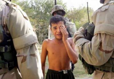 he is only a child  why you do such this bad treathment silly bad soldires